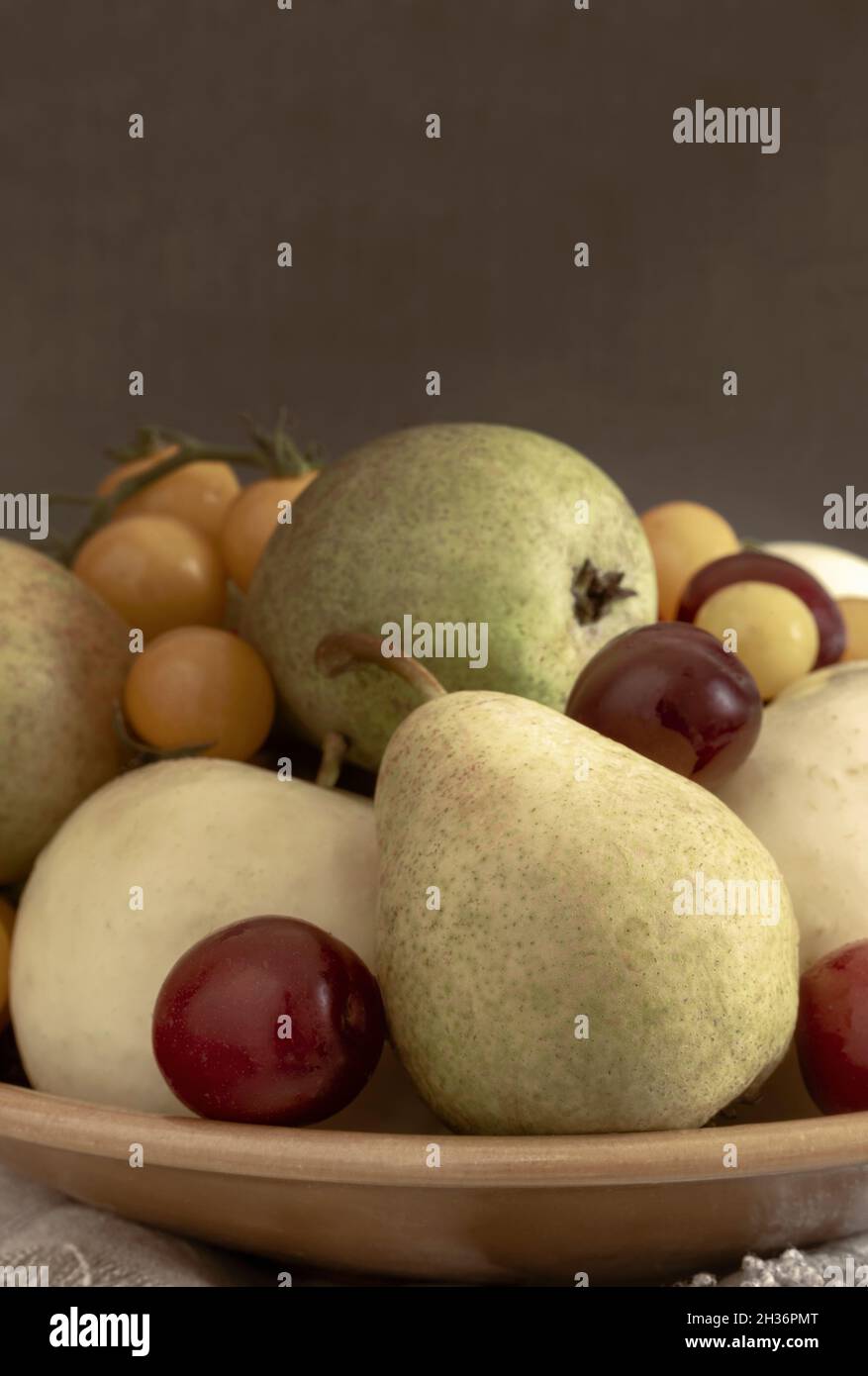 Still life: fruit in a ceramic plate Stock Photo