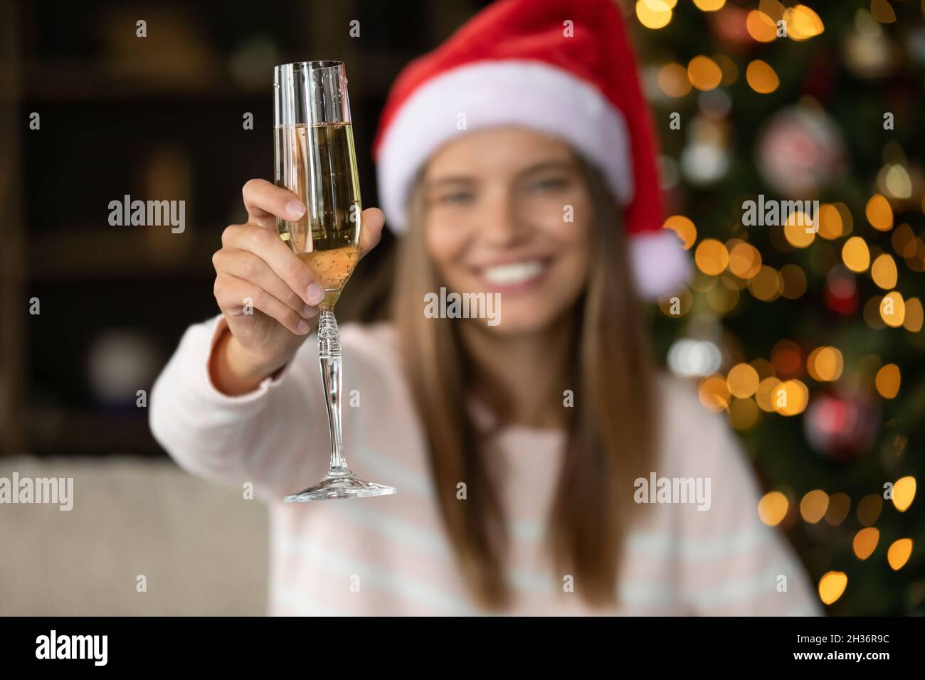 Happy woman holding New Year flute of Champagne Stock Photo