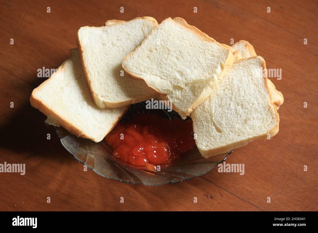 slices of fragrant white bread and fresh sauce for sandwiches, burgers, and more. Stock Photo