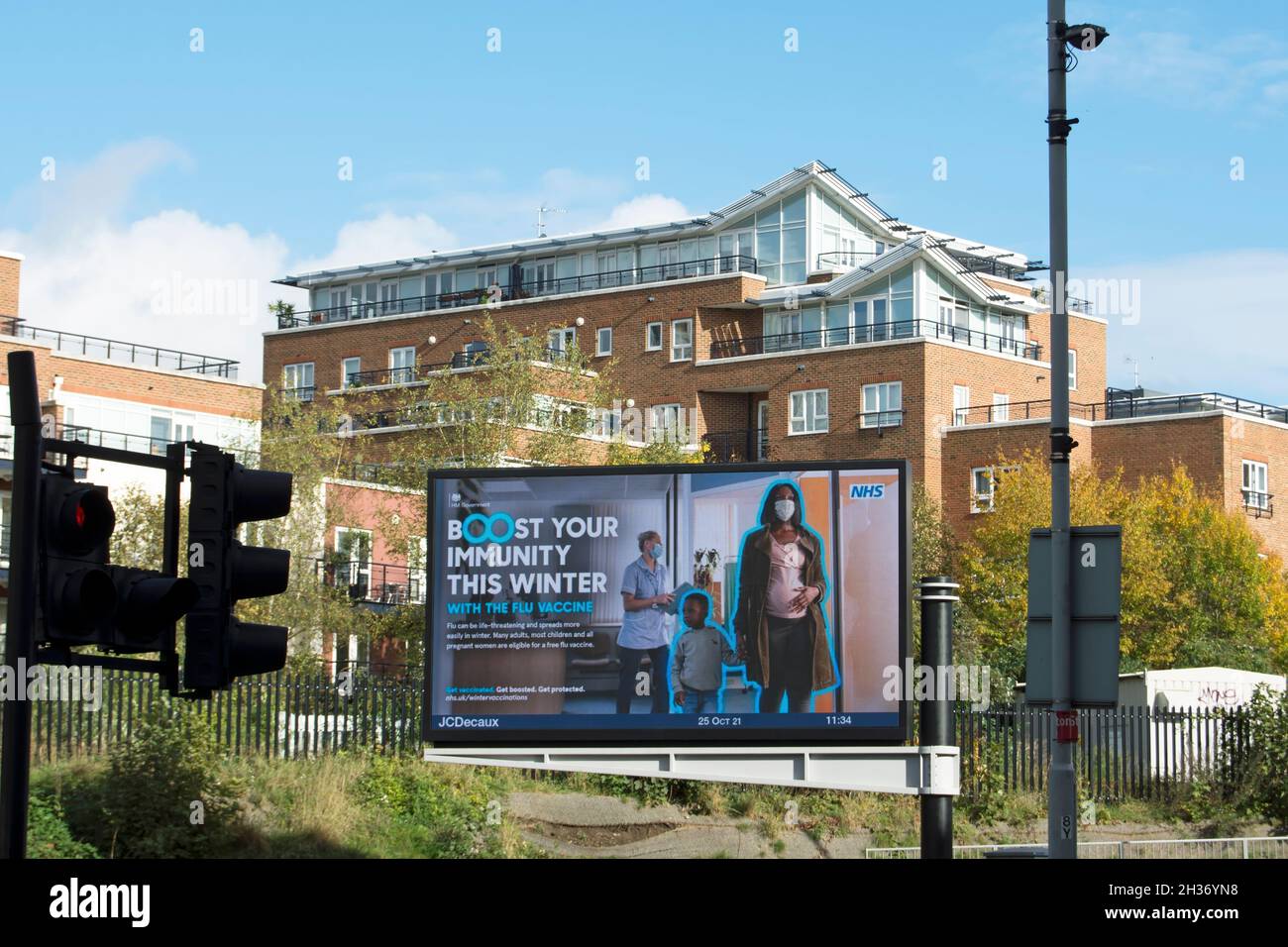 digital billboard with national health service campaign advert advising uptake of flu vaccine, kingston upon thames, surrey, england Stock Photo