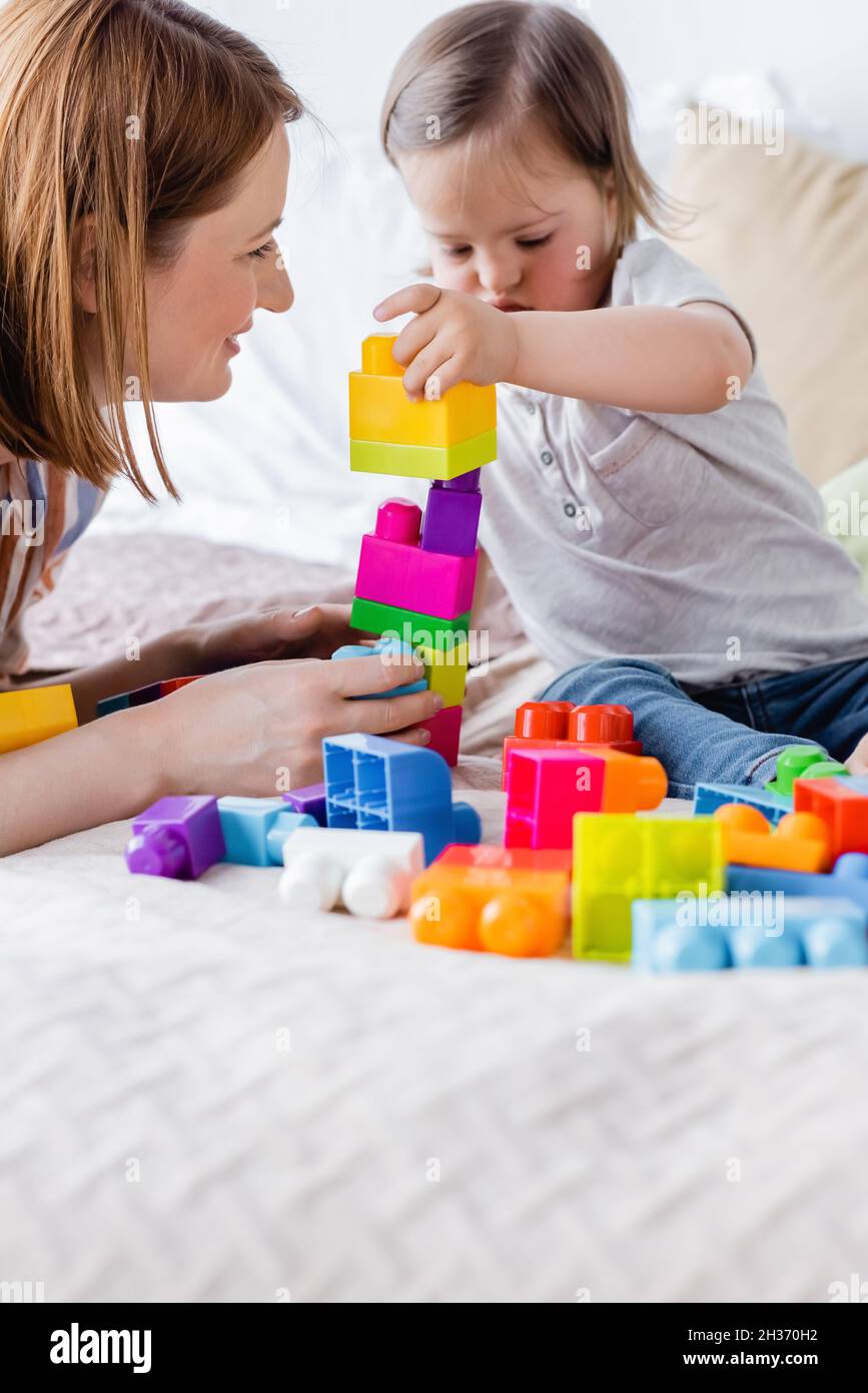 Mother child playing colorful building hi-res stock photography and ...