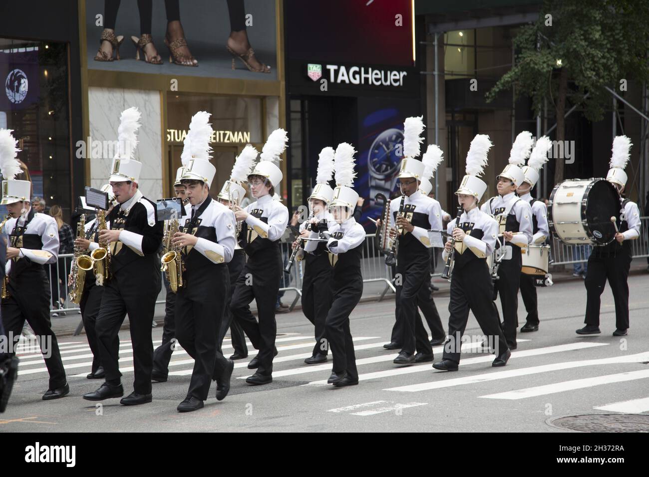 High School marching band plays up 5th Avenue at the