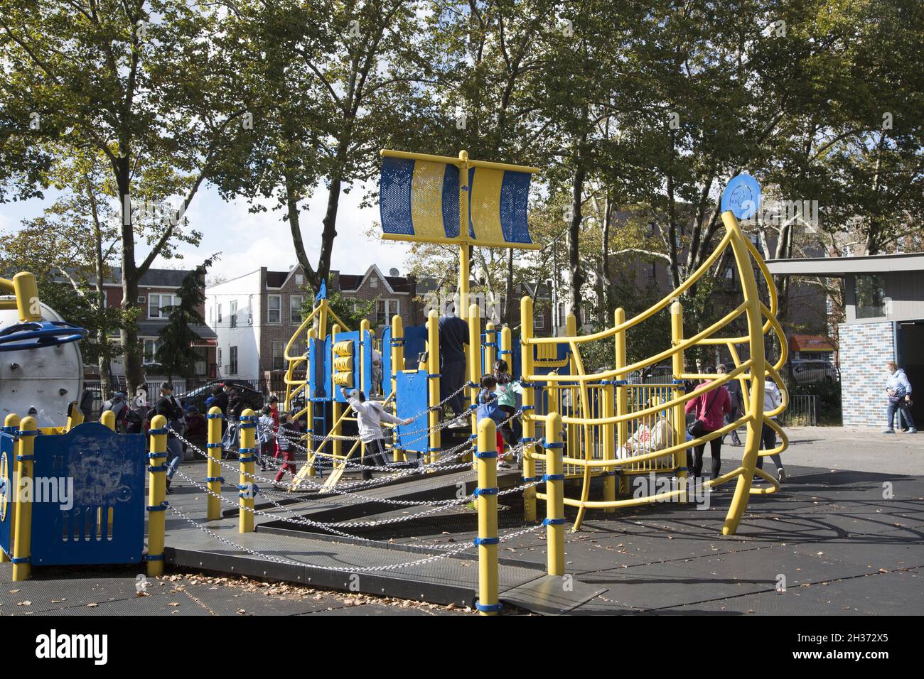 Children play on the Viking ship jungle gym at Leif Ericson Park in Brooklyn, New York. Stock Photo