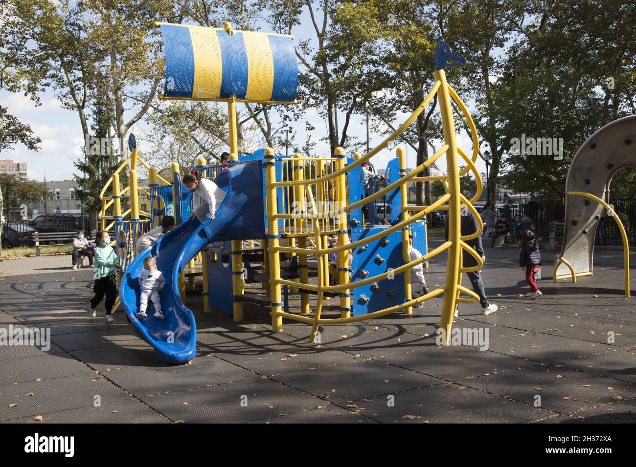 Children play on the Viking ship jungle gym at Leif Ericson Park in Brooklyn, New York. Stock Photo