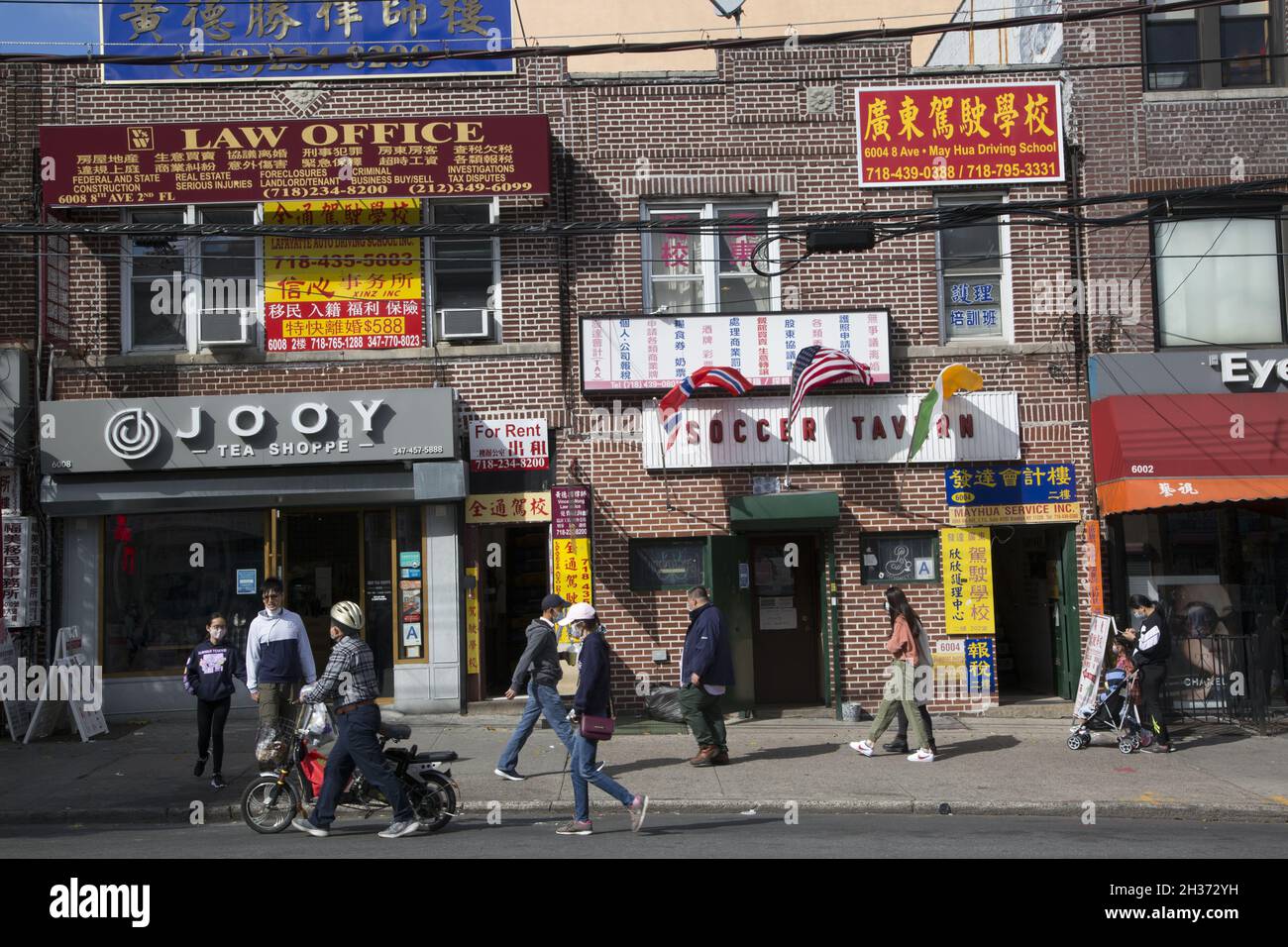 Residents out and about along 8th Avenue in the CHinatown neighborhood