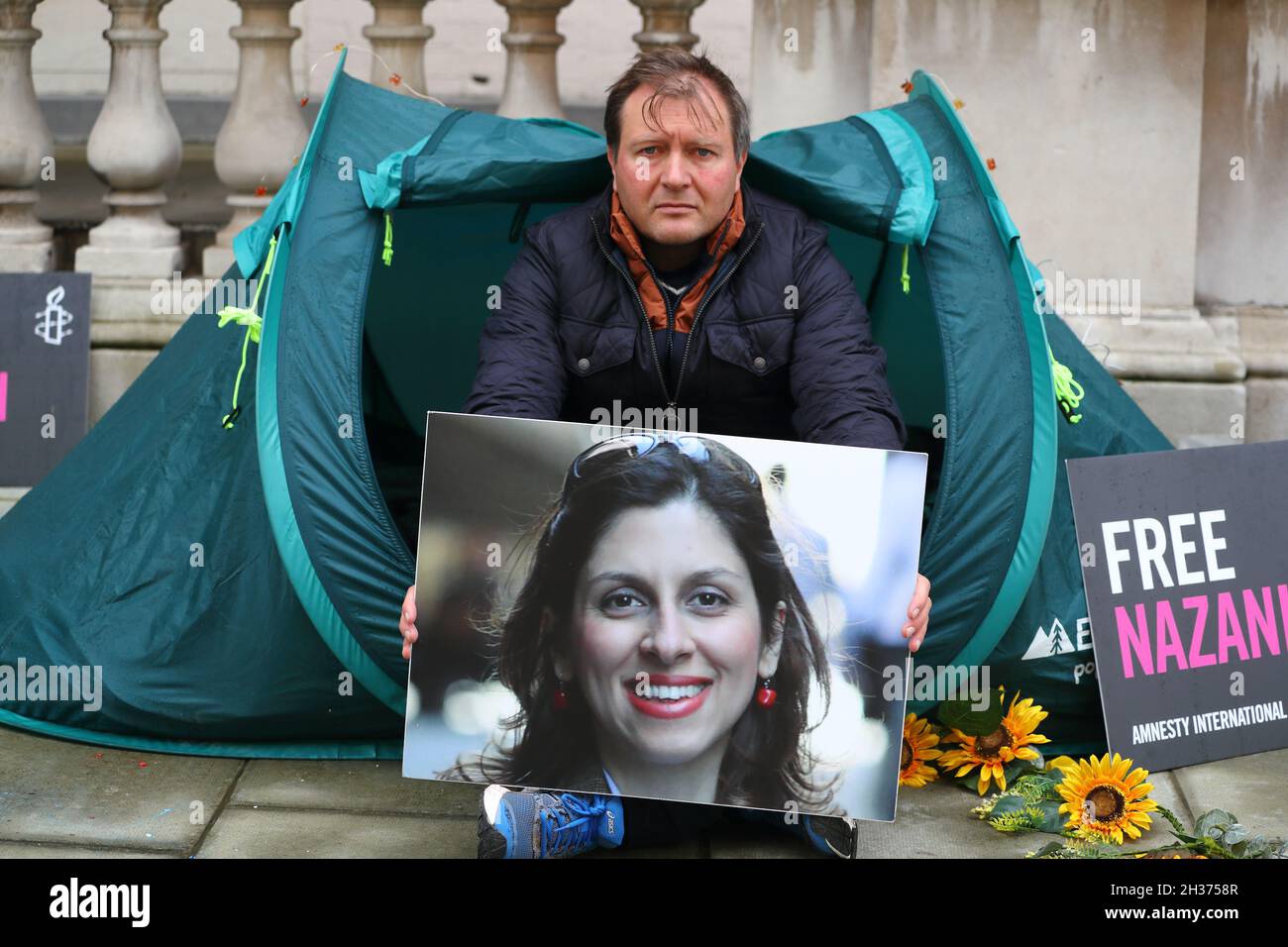 London, UK. 26th Oct, 2021. London, UK, October 26th. Nazanin Zaghari-Ratcliffe's husband Richard begins the second day of his hunger strike outside the Foreign and Commonwealth Office demanding the government does more to free his wife who is detained in Iran on spying charges since 2016 and has not seen her daughters since 2 years. Credit: Uwe Deffner/Alamy Live News Stock Photo
