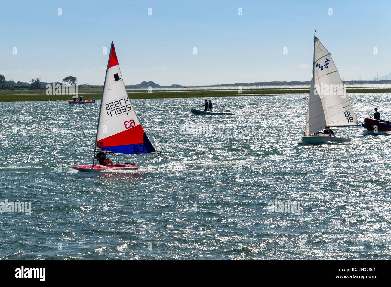 Two dinghies sailing on Chichester Harbour, UK Stock Photo