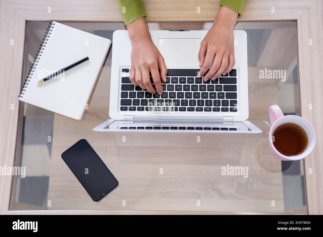 Cropped photo of hands type write laptop table workplace organized ...