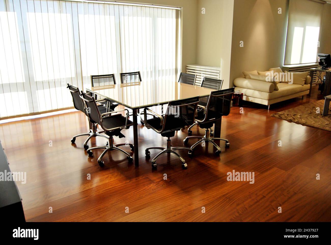 Empty meeting table and chairs in a modern conference room. Business