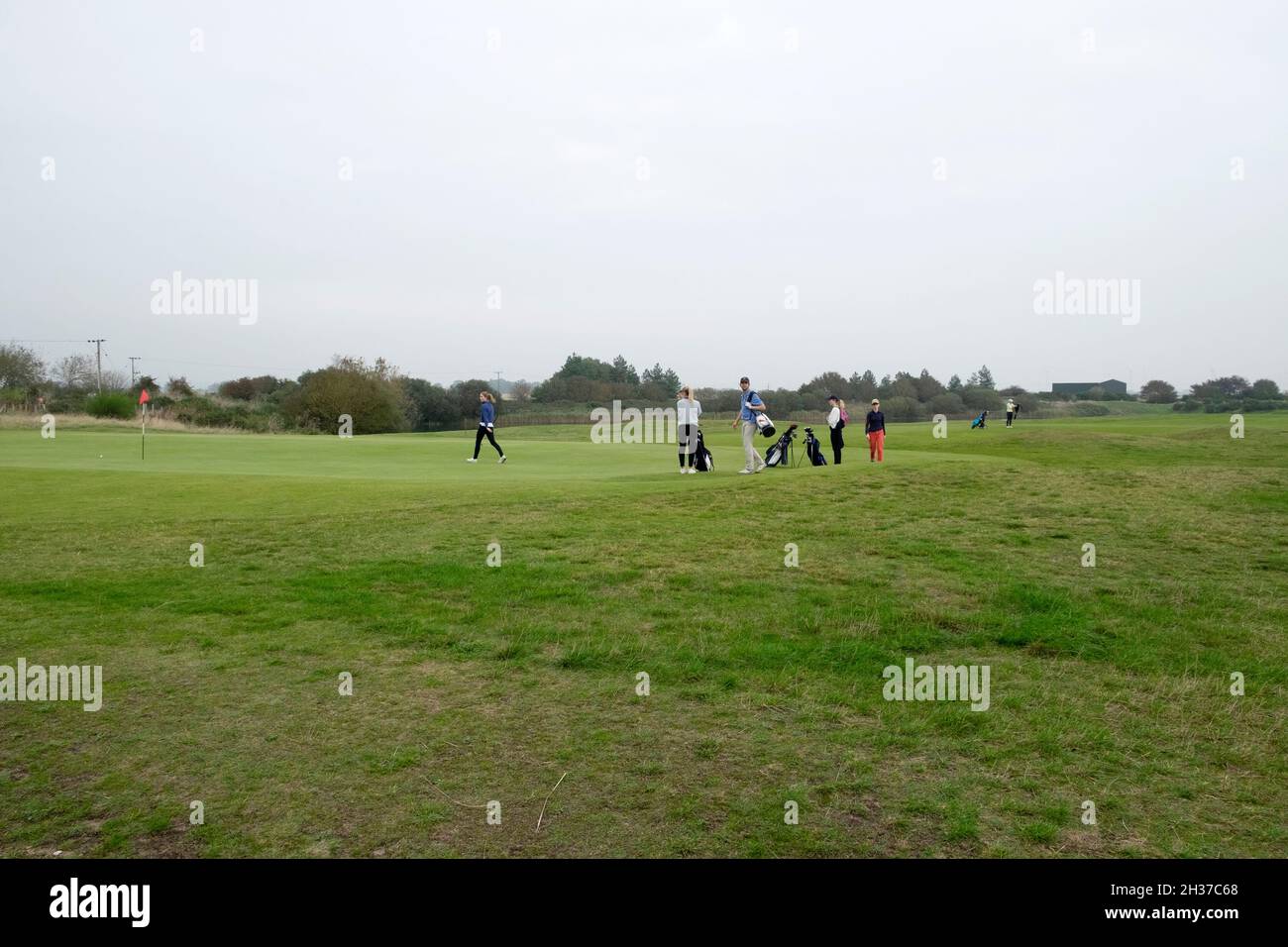 Young people playing game of golf at Rye Golf Course in Rye Kent England UK   KATHY DEWITT Stock Photo