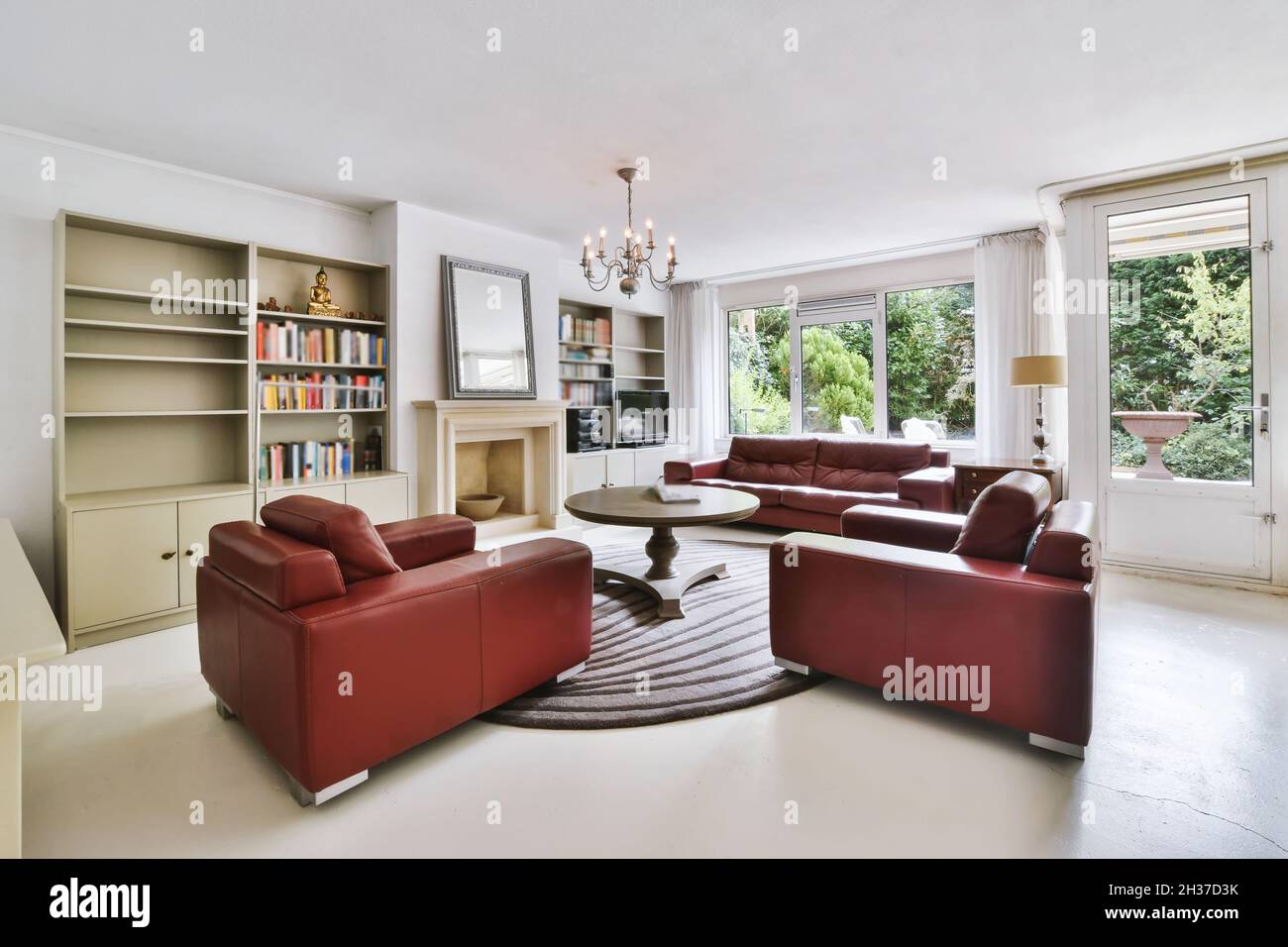 Stylish living room with big red sofa Stock Photo Alamy