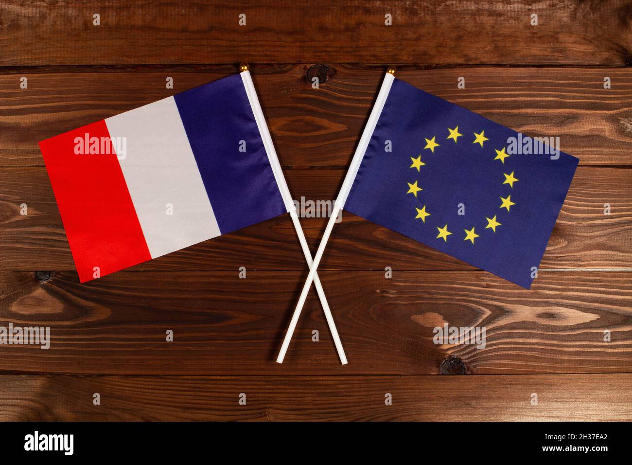 Flag of France and flag of European Union crossed with each other. France vs European Union Stock Photo