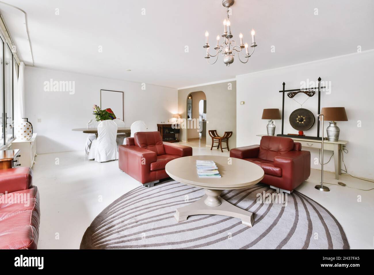 Stylish living room with big red sofa Stock Photo Alamy