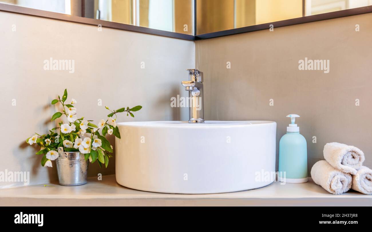 Bathroom sink basin and faucet, modern interior detail. Chrome mixer