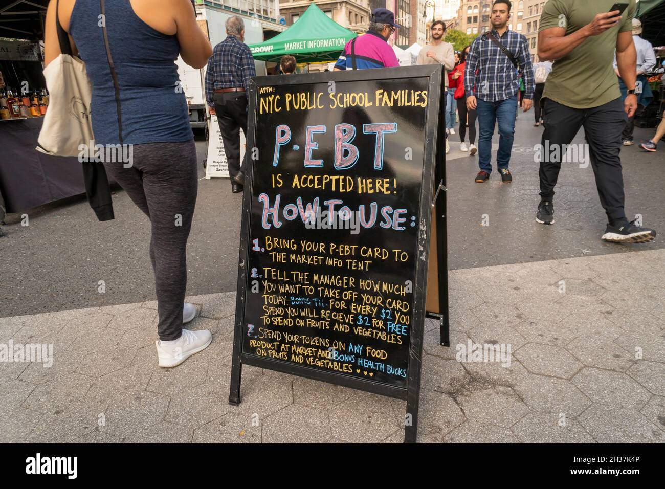 A sign promotes the use of PEBT cards in the Union Square Greenmarket