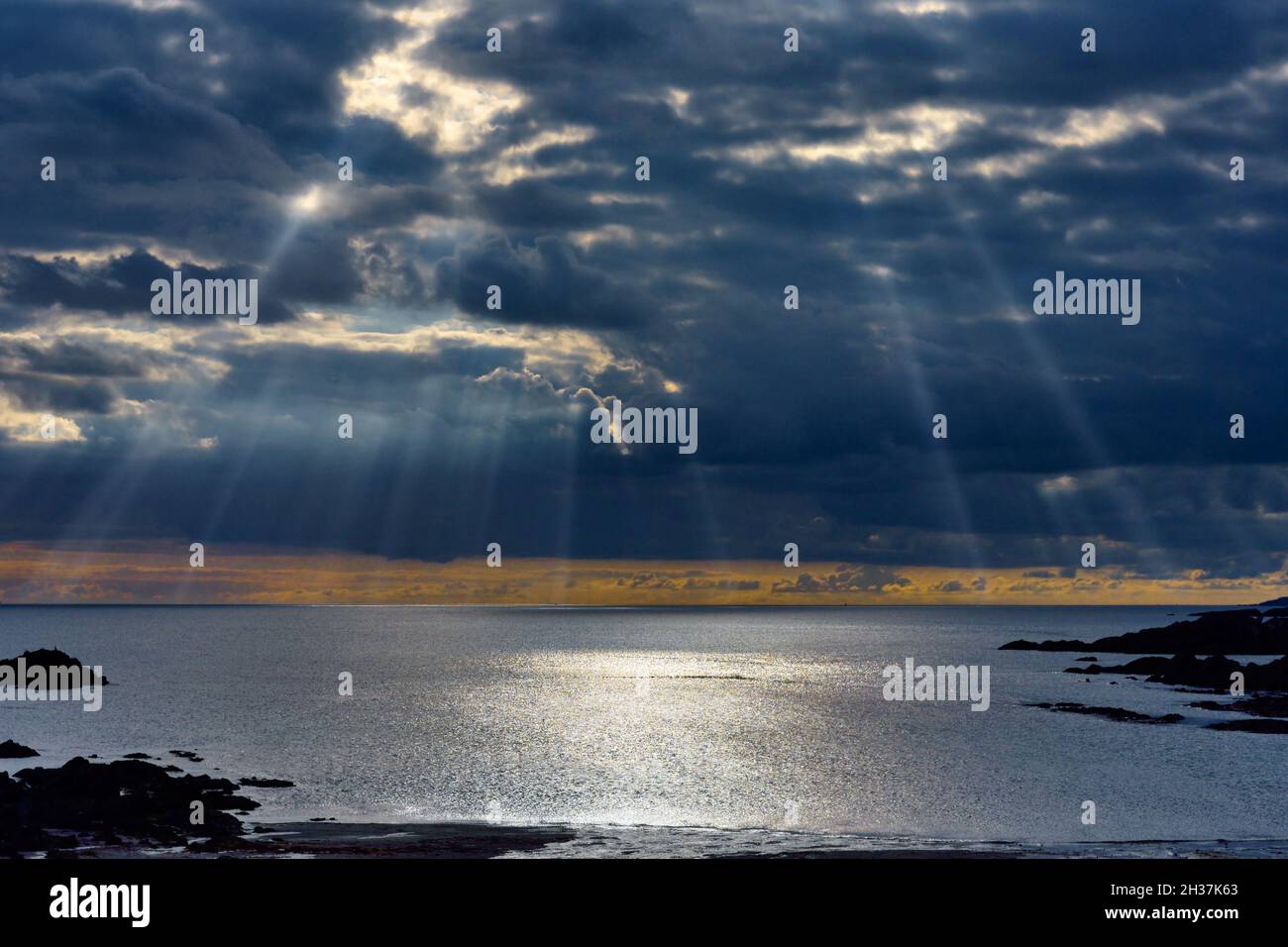 Stunning sunrays breaking through storm clouds in South Devon, UK Stock Photo