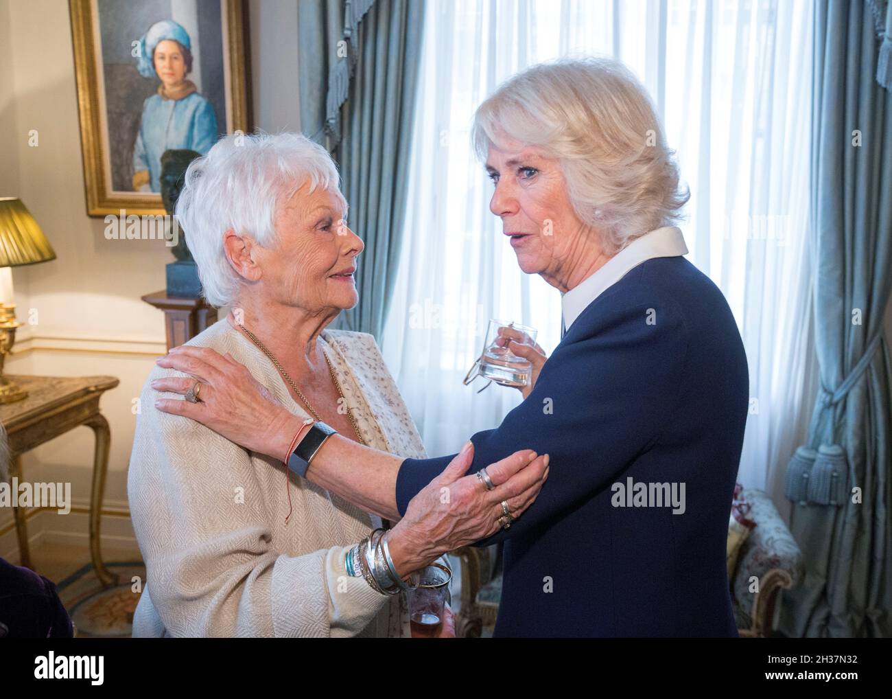 Britain's Camilla, Duchess of Cornwall speaks with Dame Judy Dench as she hosts a reception for