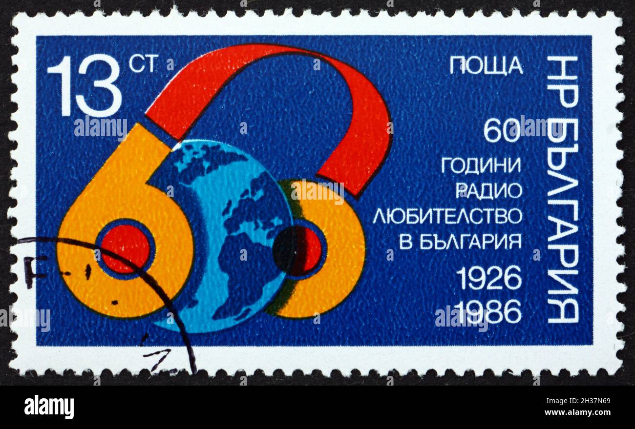 BULGARIA - CIRCA 1986: a stamp printed in Bulgaria dedicated to Home Amateur Radio Operators in Bulgaria, 60th Anniversary, circa 1986 Stock Photo