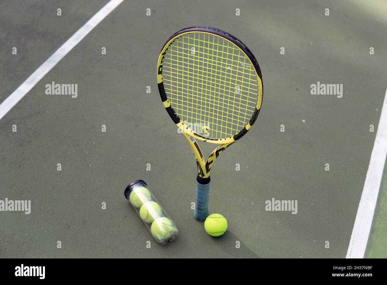 close-up. male hands holding tennis racket and balls. bali Stock Photo