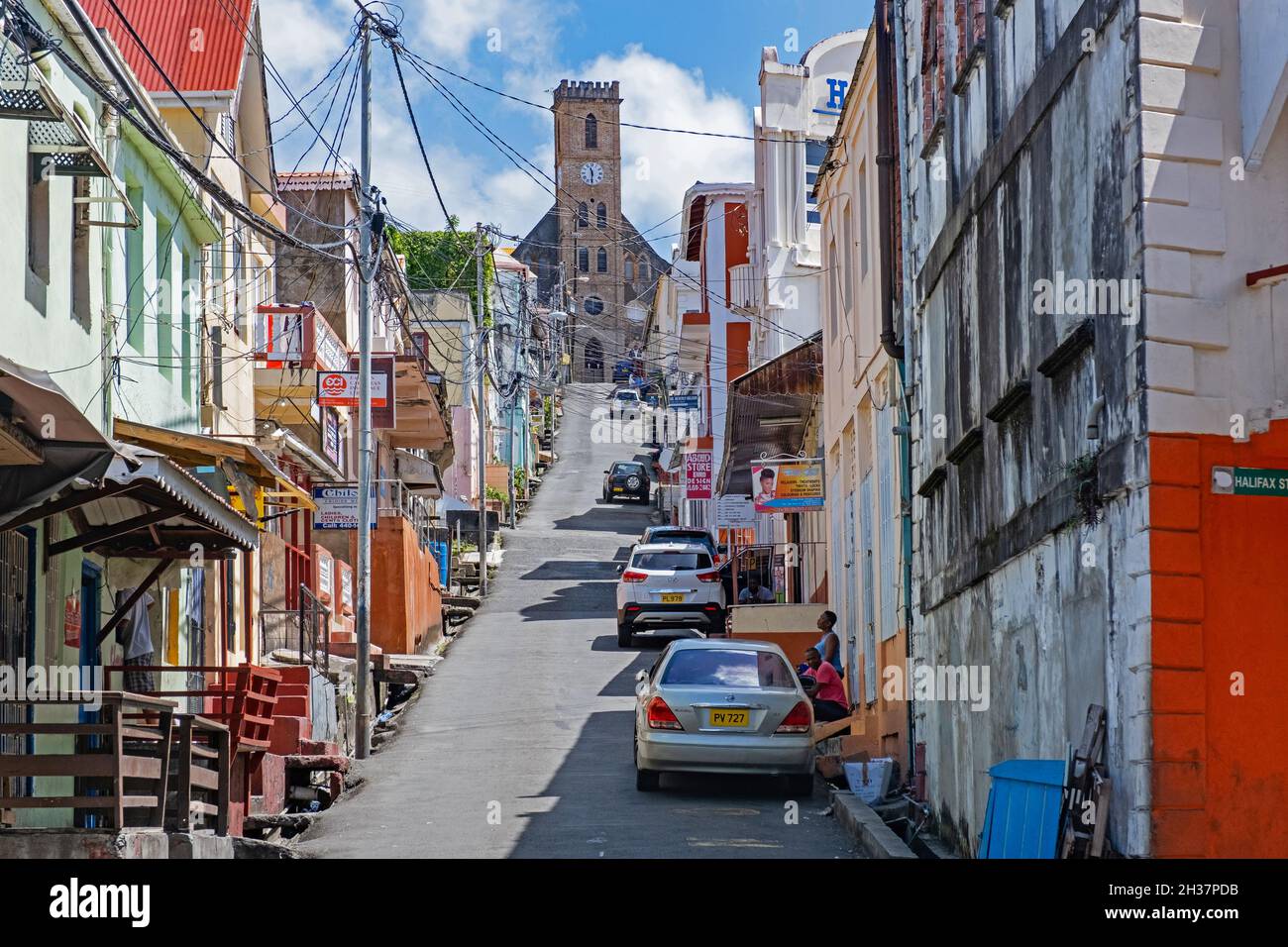 Street with shops and the Roman Catholic Cathedral at the capital city St. George's on the west coast of the island of Grenada, Caribbean Stock Photo