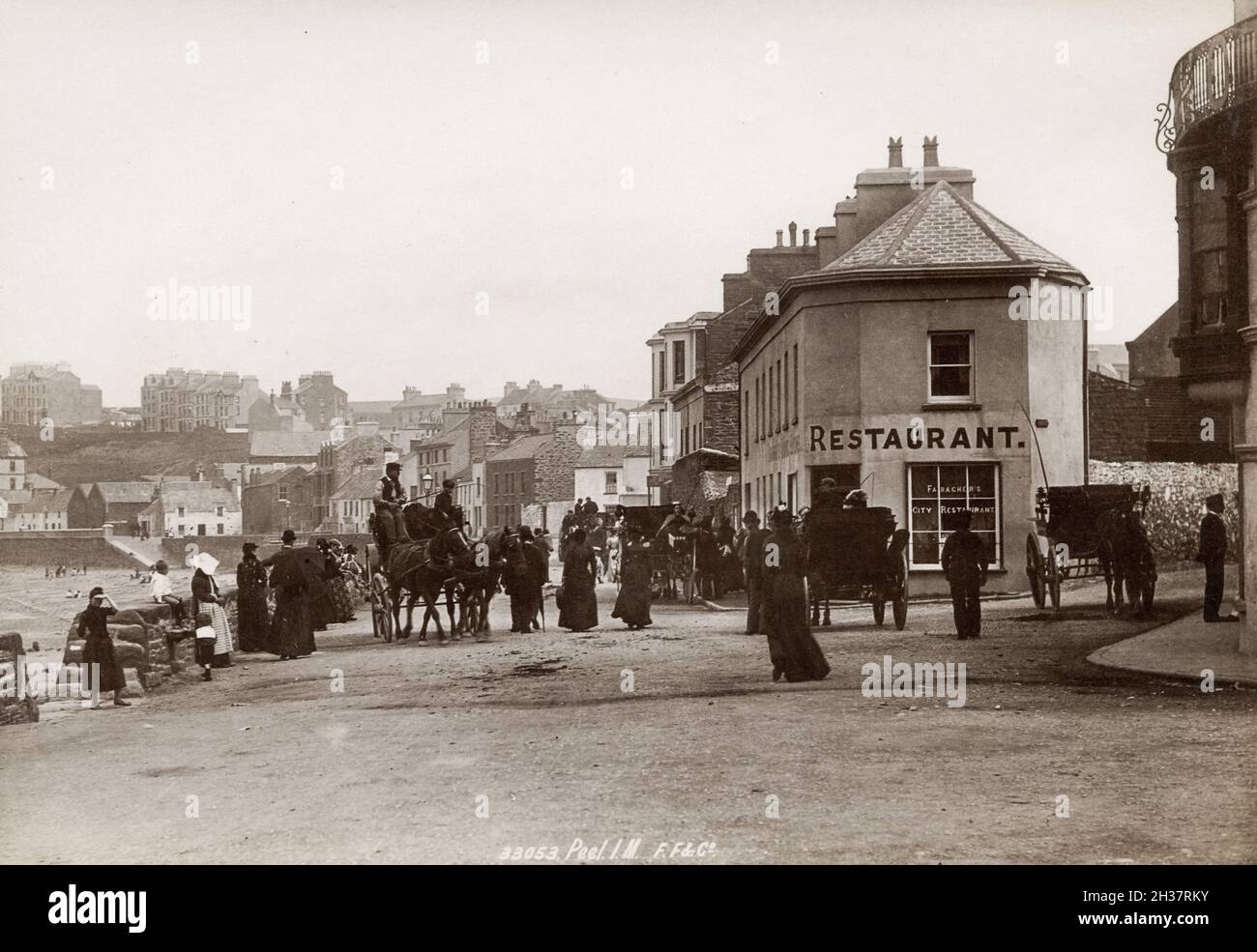 Late 19th or early 20th century vintage photograph: Street and harbour, Peel, Isle of Man Stock Photo