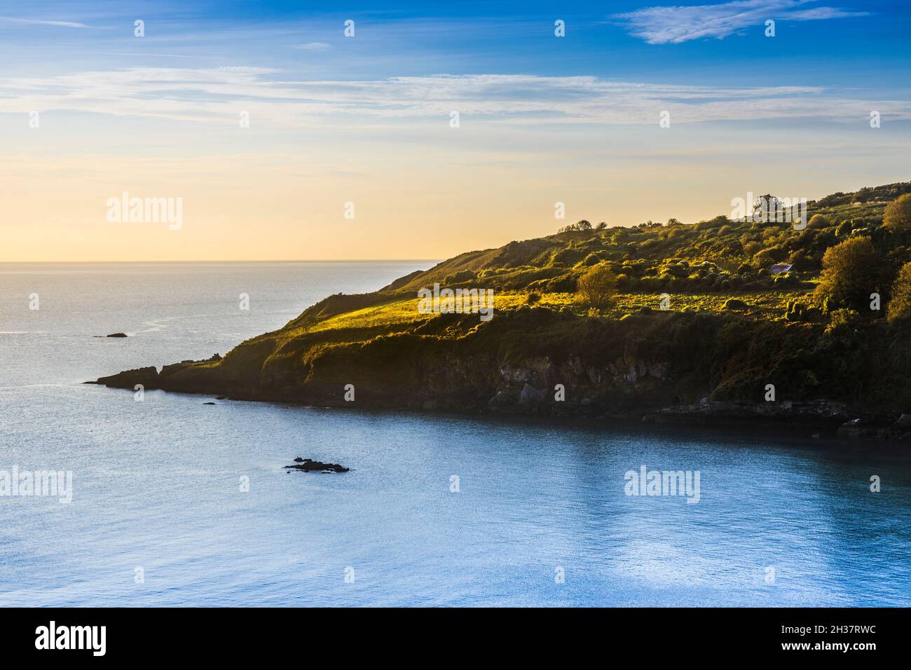 Early morning light falls on St.Mary's Bay in south Devon. Stock Photo