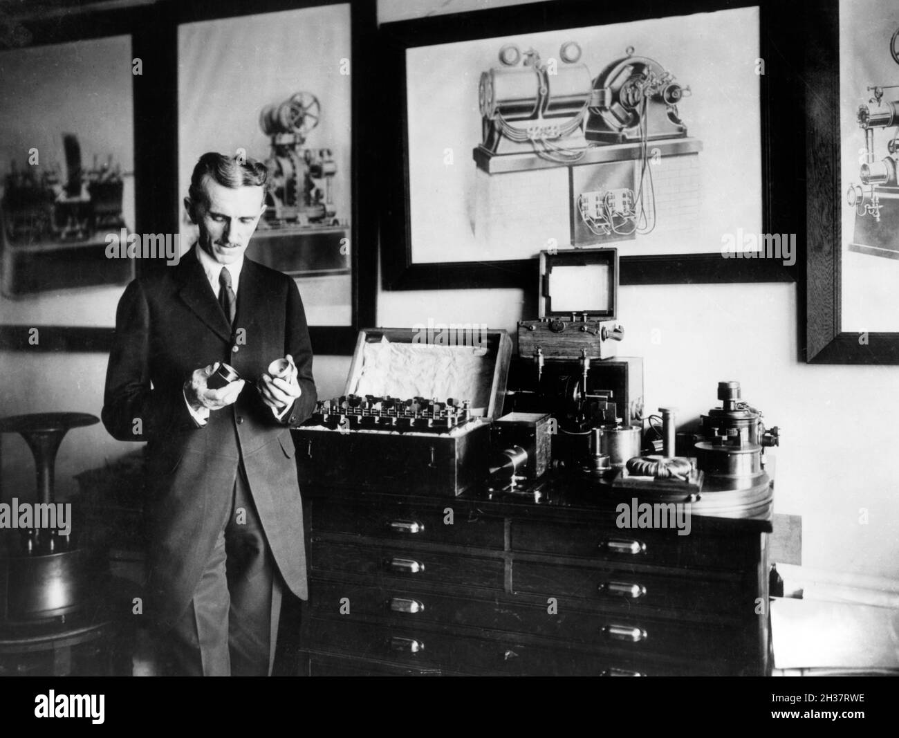 Nikola Tesla (1856-1943) in his New York Laboratory, c. 1910. Tesla was a Serbian American inventor and engineer best known for his work on alternating current (AC) electricity supply. Stock Photo