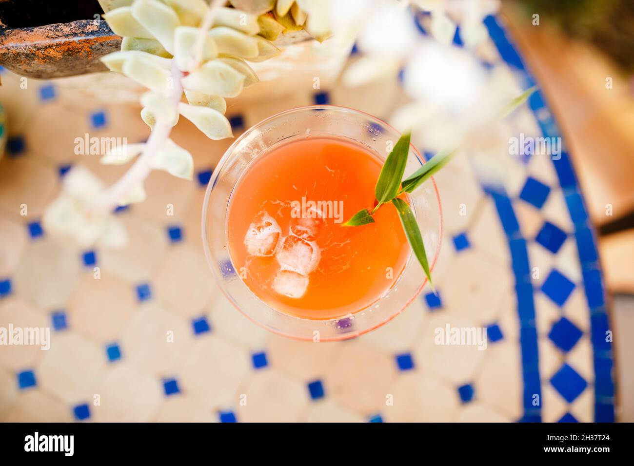 Aperol Spritz glass cocktail in a tropical setting Stock Photo