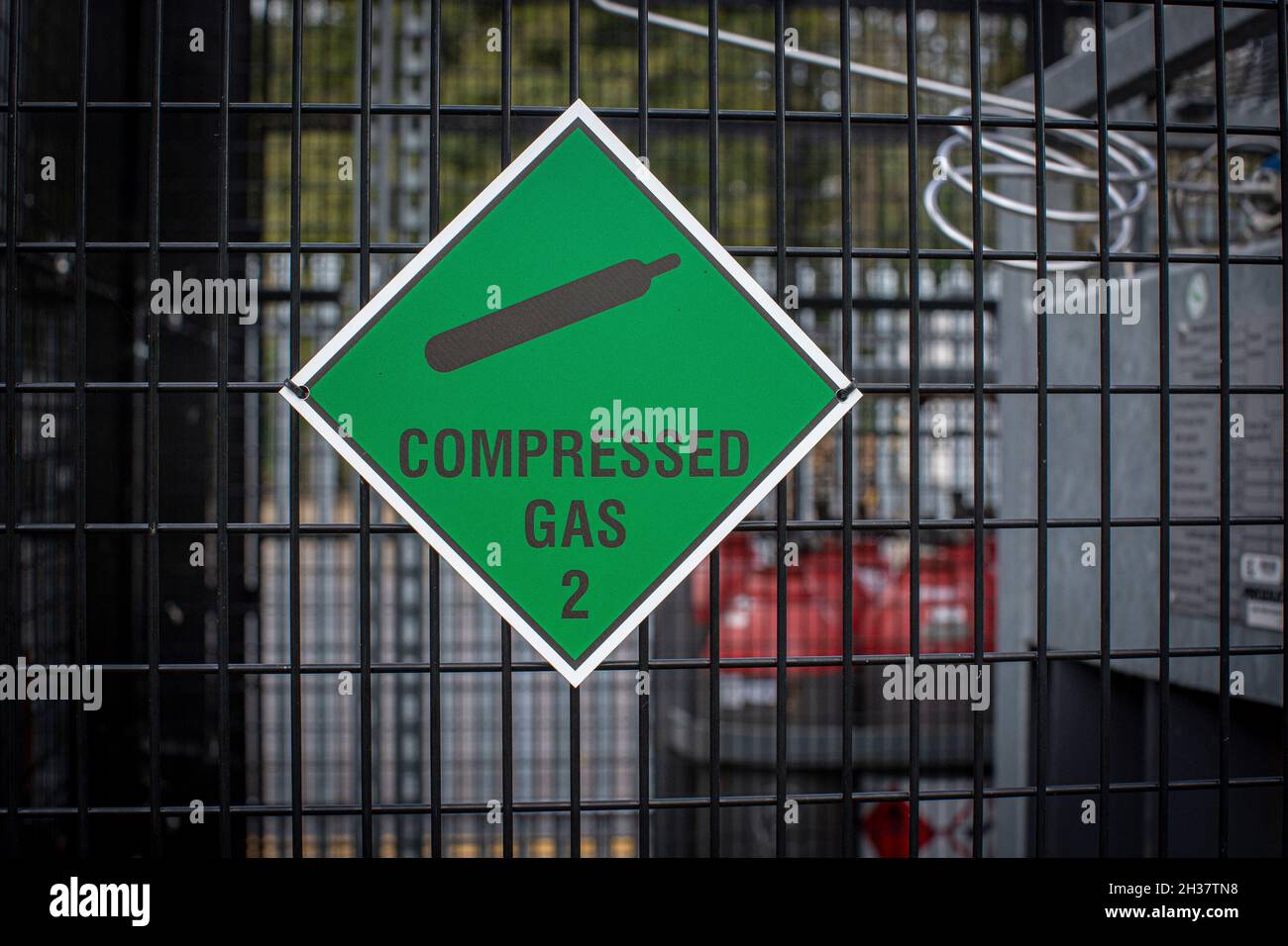 Gas bottles in storage yard. Various gaseous chemicals stored in steel