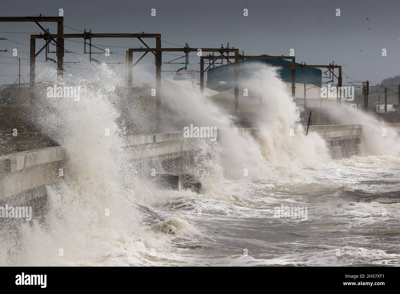 Saltcoats, UK. 26th Oct, 2021. Strong winds gusting in excess of 50 mph on the west coast of Ayrshire, Scotland caused waves about 20 metres high crashing into the promenade at Seaview Road, the popular walkway between Saltcoats and Stevenston., Credit: Findlay/Alamy Live News Stock Photo