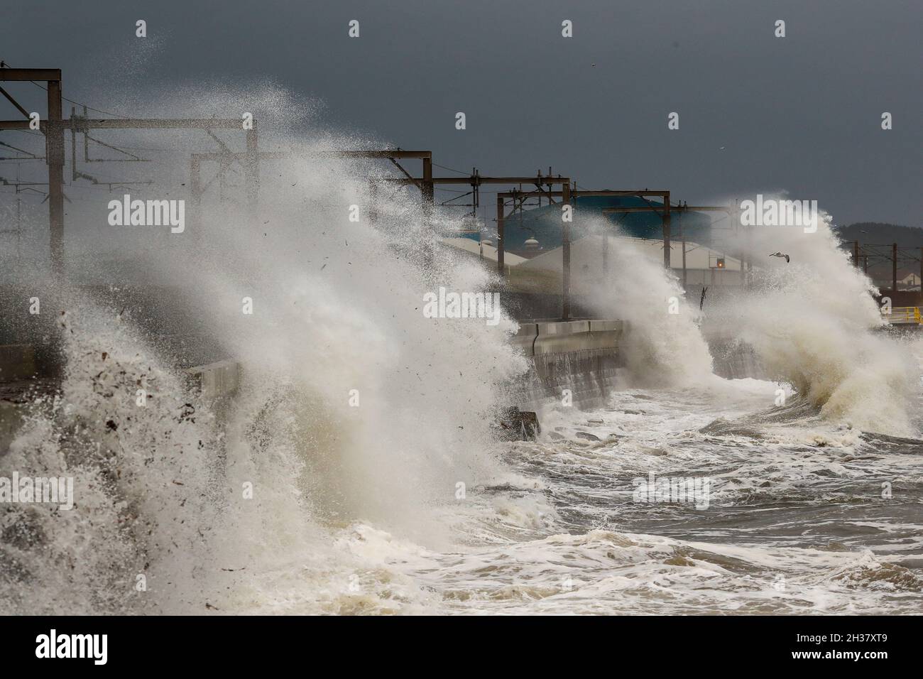 Saltcoats, UK. 26th Oct, 2021. Strong winds gusting in excess of 50 mph on the west coast of Ayrshire, Scotland caused waves about 20 metres high crashing into the promenade at Seaview Road, the popular walkway between Saltcoats and Stevenston., Credit: Findlay/Alamy Live News Stock Photo
