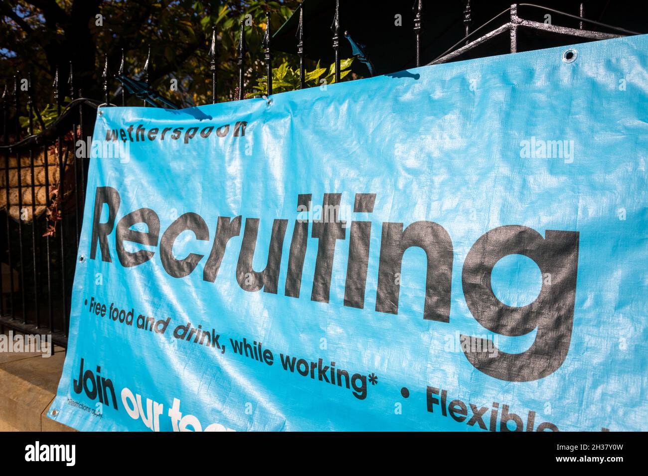 Recruitment banner outside a Wetherspoon's pub, UK Stock Photo
