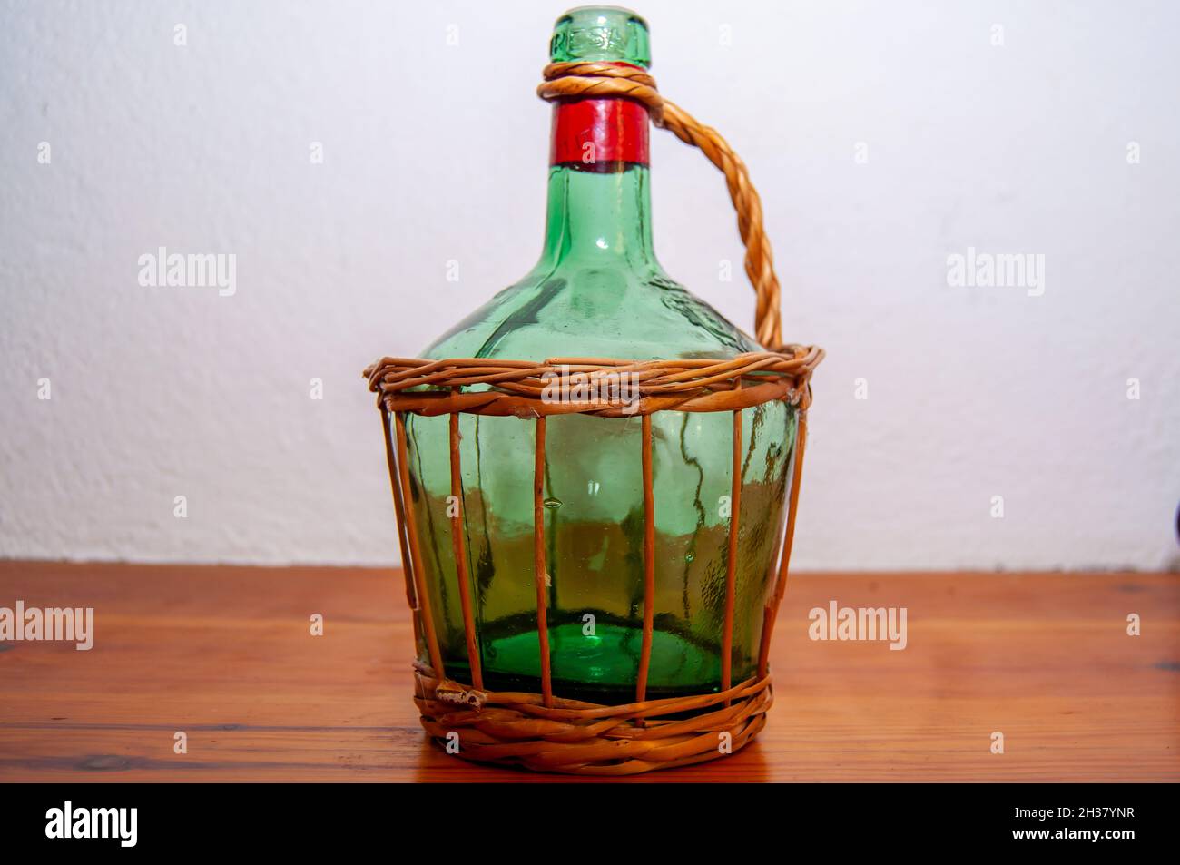 Ancient glass water pitcher with wicker handler Stock Photo Alamy