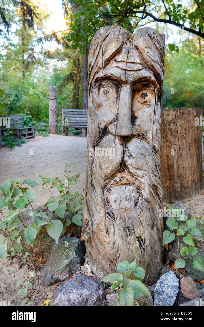 Slavic pagan wooden idol in the forest. Wooden statue, the image of the  Slavic god. Attribute of religious rites Stock Photo - Alamy