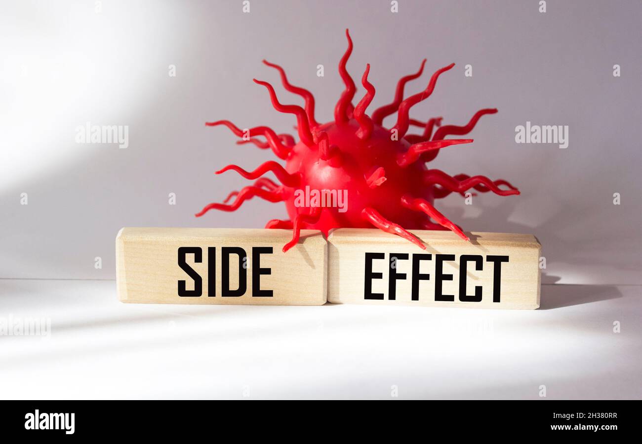 SIDE EFFECTS on wooden blocks and white background. Pharmaceutical ...