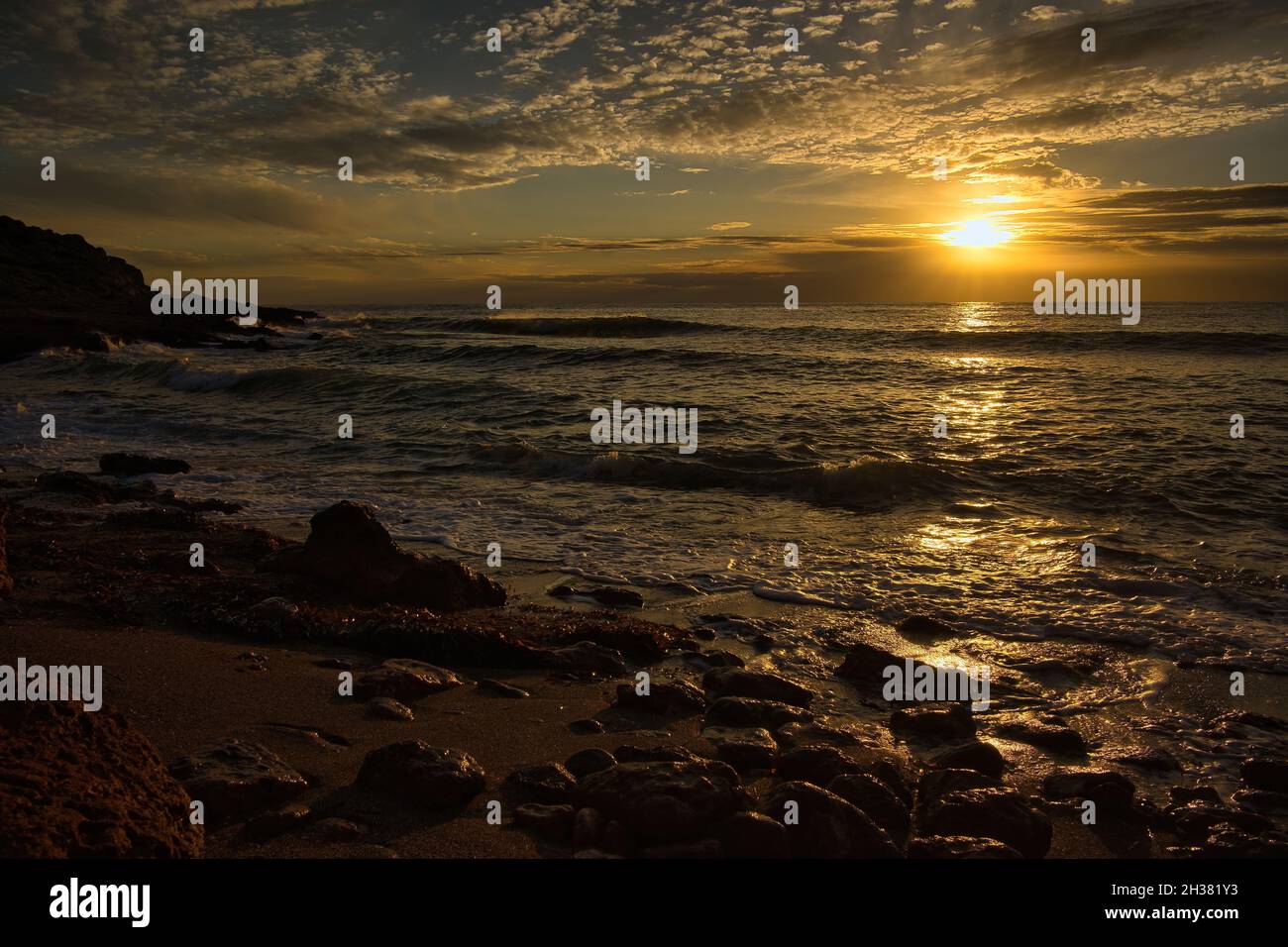 The coast in the Mediterranean Sea at sunrise Stock Photo