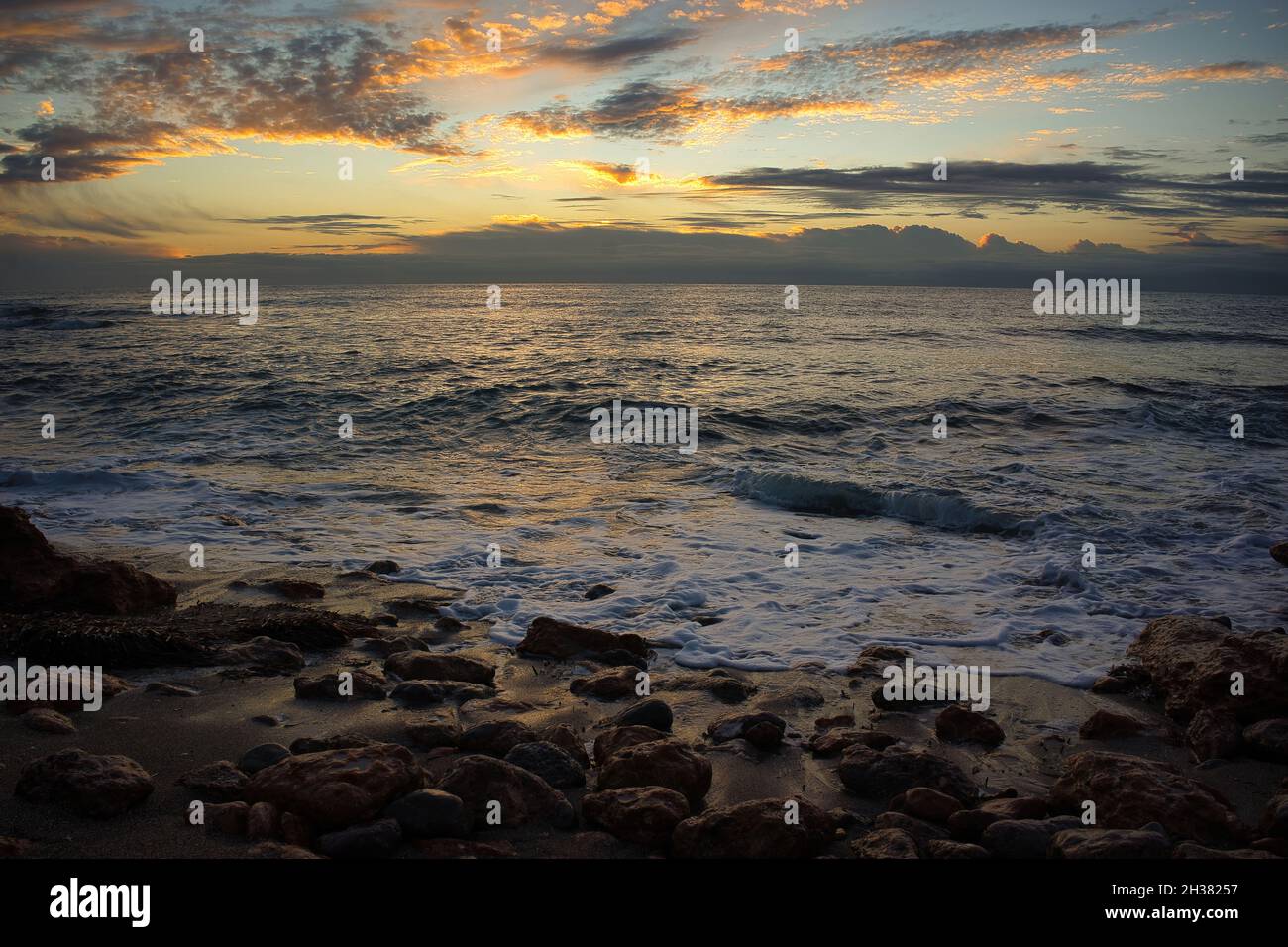 The coast in the Mediterranean Sea at sunrise Stock Photo