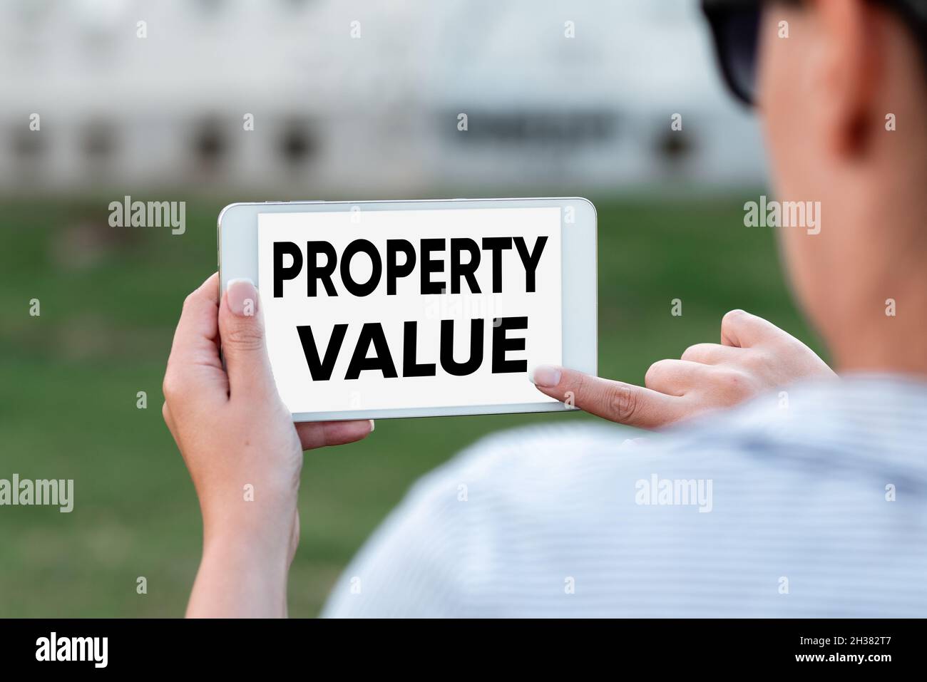 Text showing inspiration Property Value. Business idea Worth of a land Real estate appraisal Fair market price Voice And Video Calling Capabilities Stock Photo