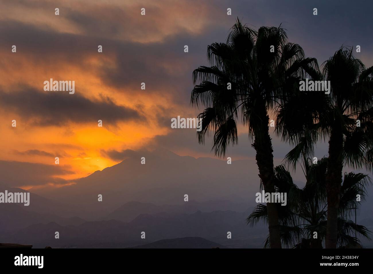 Sunset over the mountains in Busot area.Spain, Alicante province.Horizontal view. Stock Photo