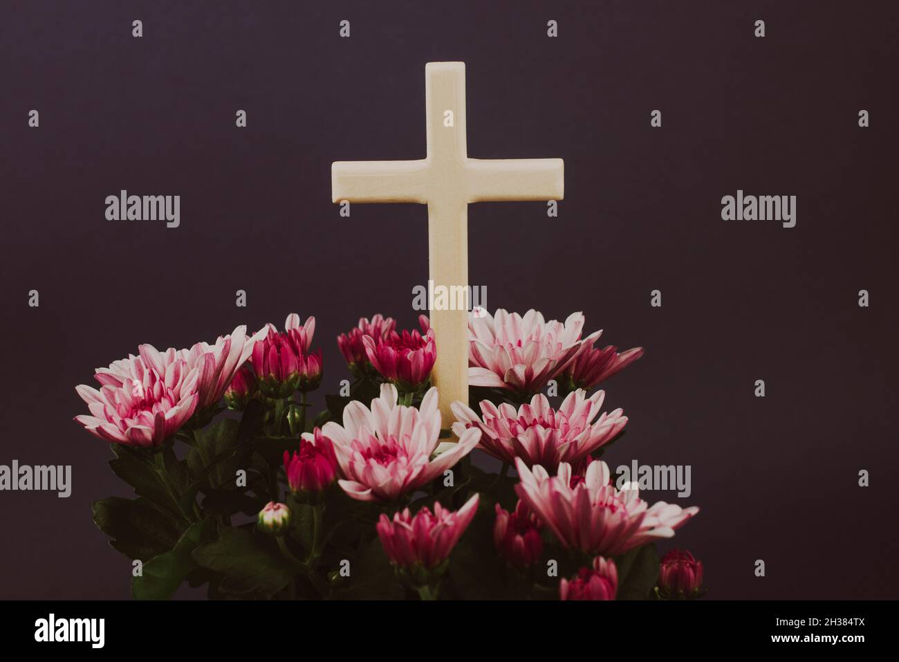 Composition of flowers and wooden cross for all souls day. Also ...