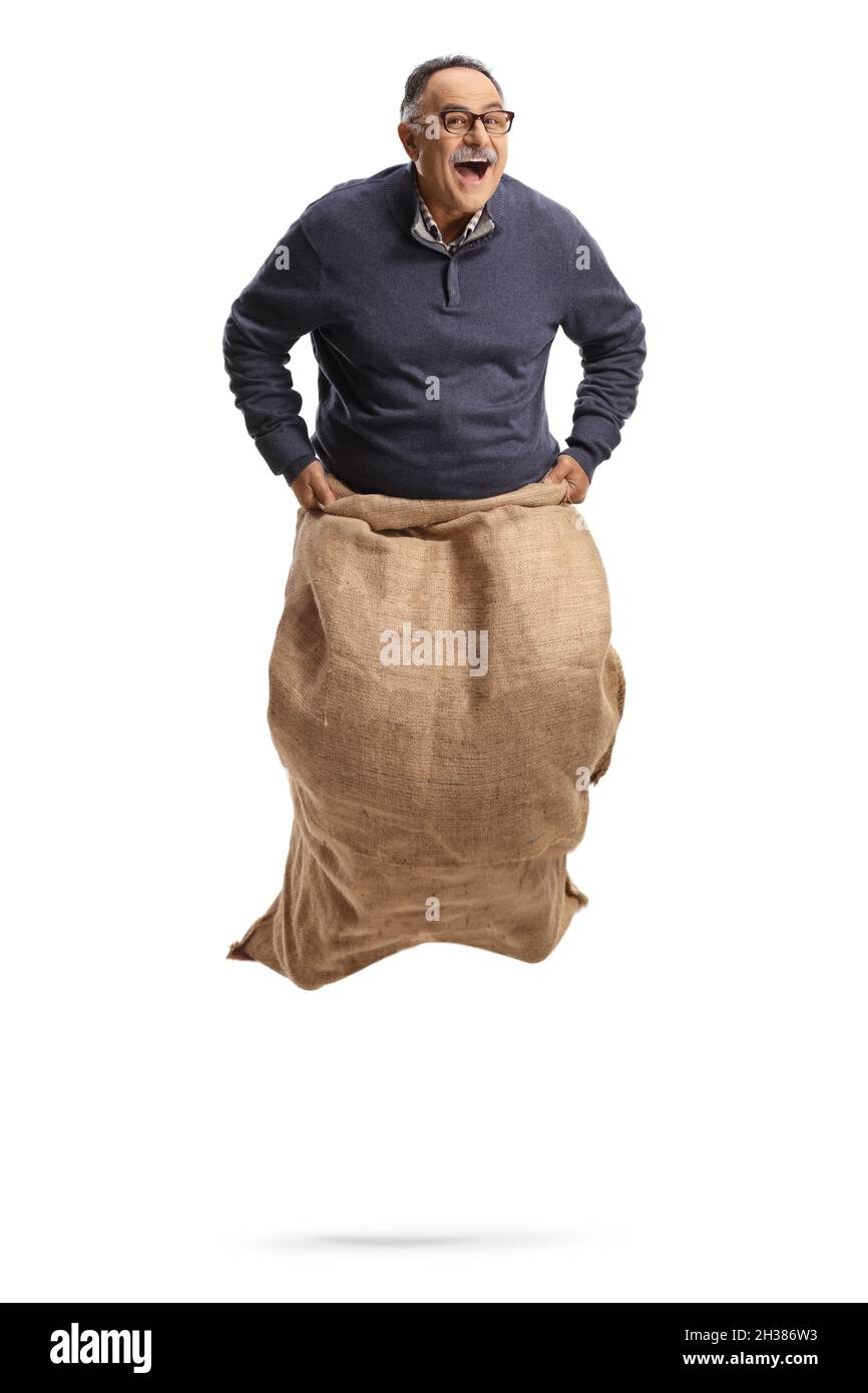 Funny mature man jumping in a sack isolated on white background Stock Photo