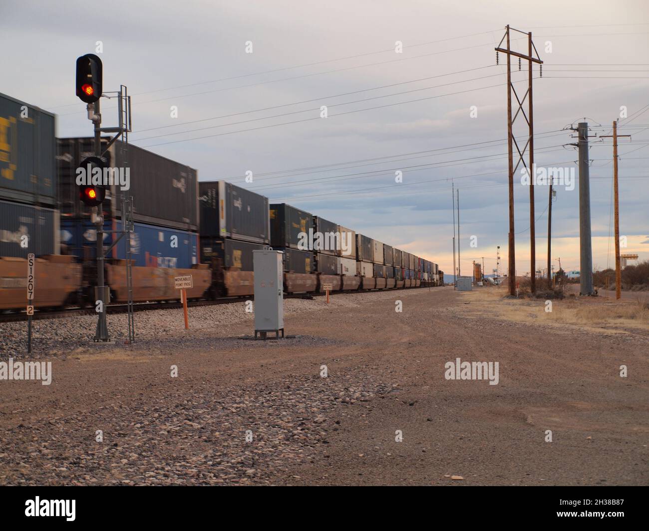 Union Pacific train through the American Southwest at Deming, New Mexico. Both enclosed auto carriers and containers are shown heading west at speed. Stock Photo