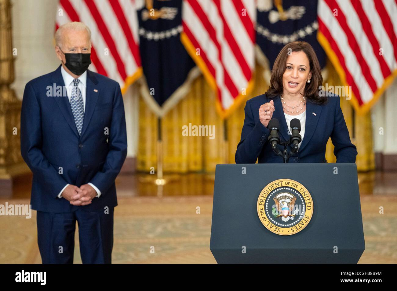 Washington, United States of America. 10 August, 2021. U.S President Joe Biden, looks on as Vice President Kamala Harris, delivers remarks on the passing of the bipartisan Infrastructure Investment and Jobs Act from the East Room of the White House, August 10, 2021 in Washington, D.C.Credit: Adam Schultz/White House Photo/Alamy Live News Stock Photo