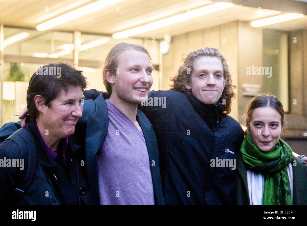 London, England, UK. 26th Oct, 2021. Highbury Corner Magistrates Court, London, UK, 26th October 2021. Tree Protectors Maria Gallastegui (62), Sebastian Roblin (27), Stefan Wright (28), Wictoria Zieke (26) walk out of Court at the end of the first day of trial. Despite last March's High Court ruling and the falling of every charge connected with the occupation of the tunnels under Euston Square on October 6, HS2 legal team amended the accusations only last Friday (22nd of October), and the tree protectors were still summoned to Court today.HS2 legal team considers the presence o Stock Photo