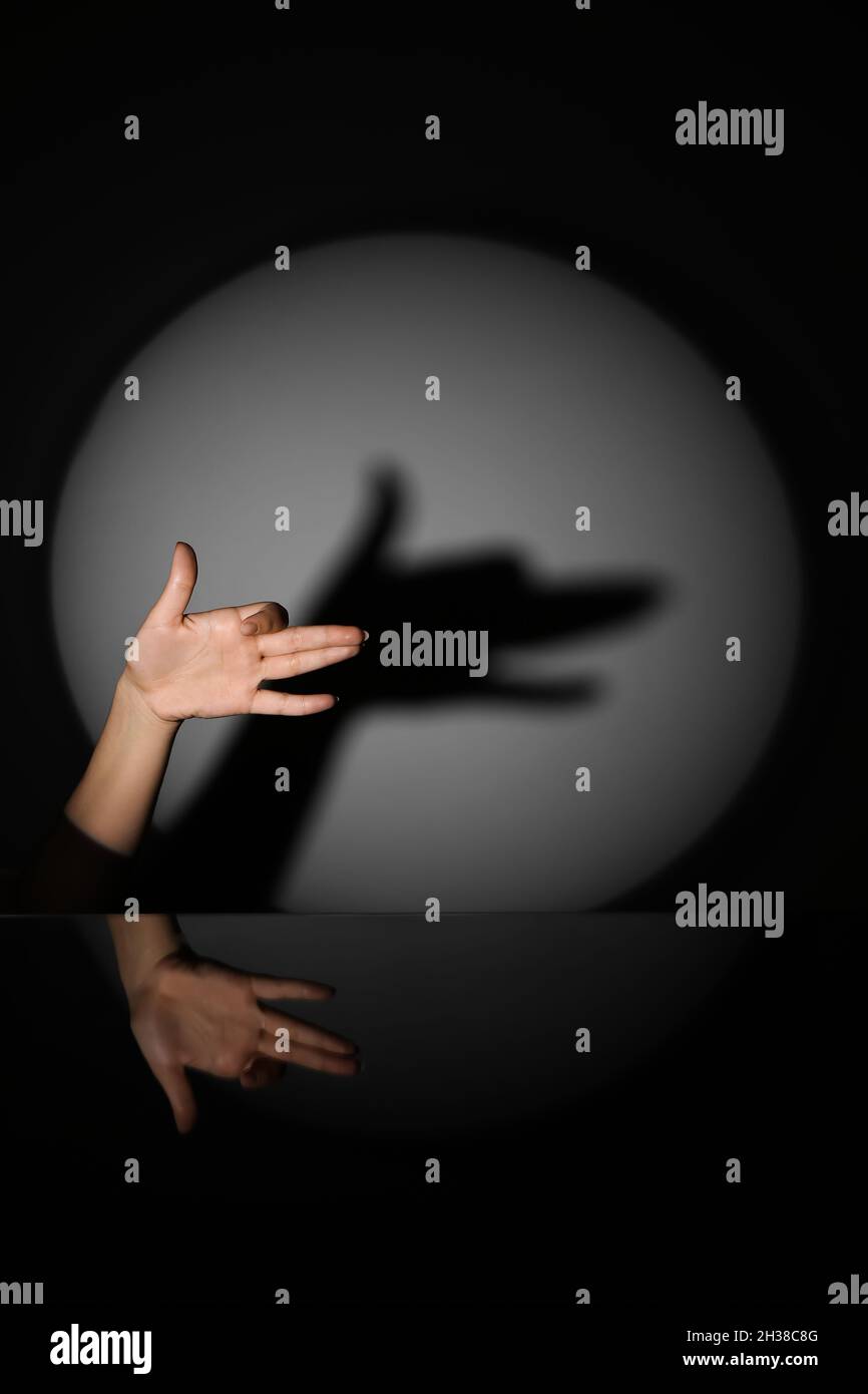 Woman performing a shadow play Stock Photo - Alamy