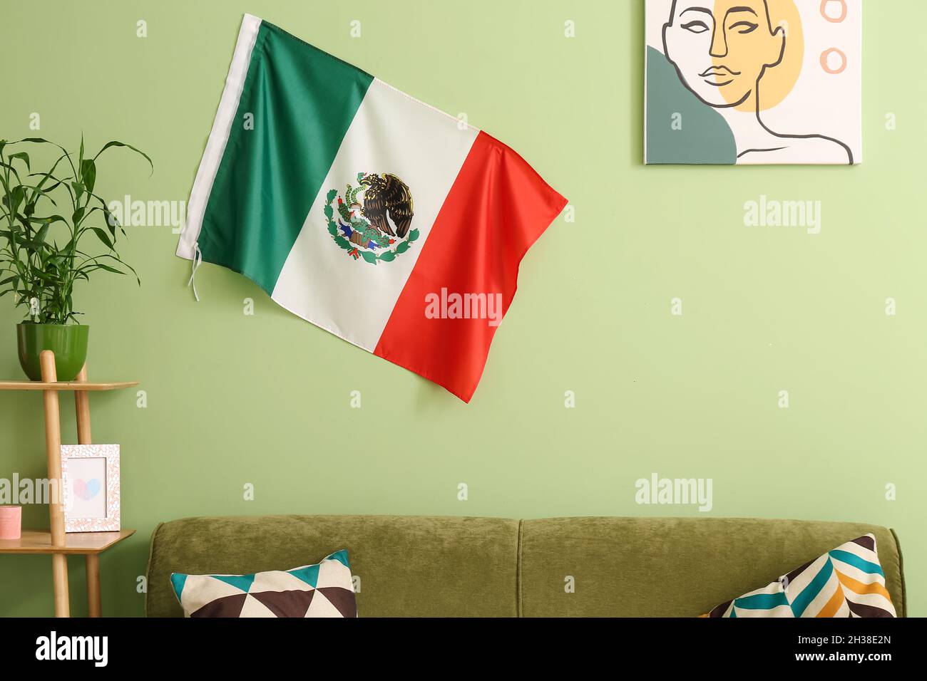 Mexican flag in interior of living room Stock Photo