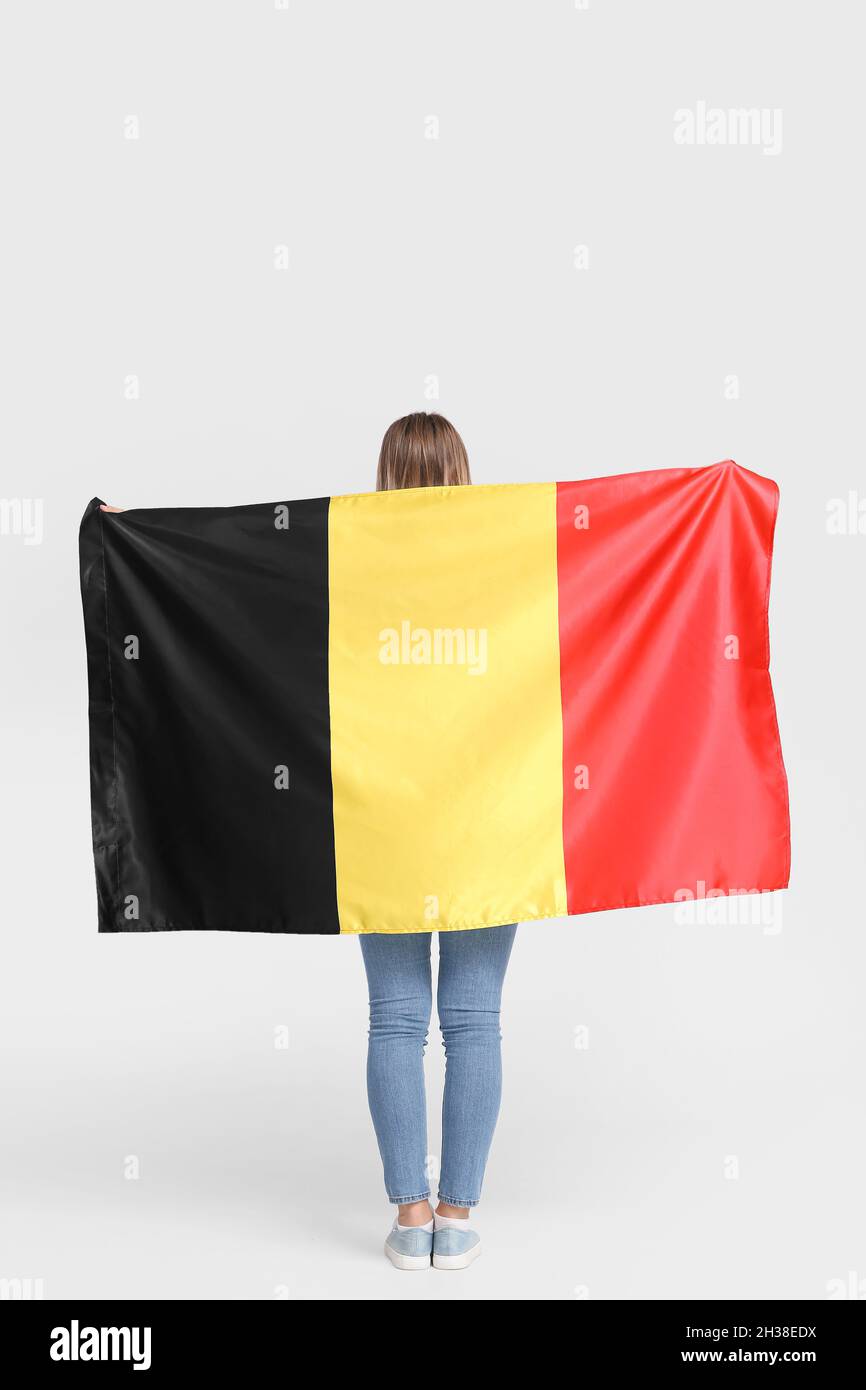 Young woman with flag of Belgium on light background, back view Stock Photo  - Alamy