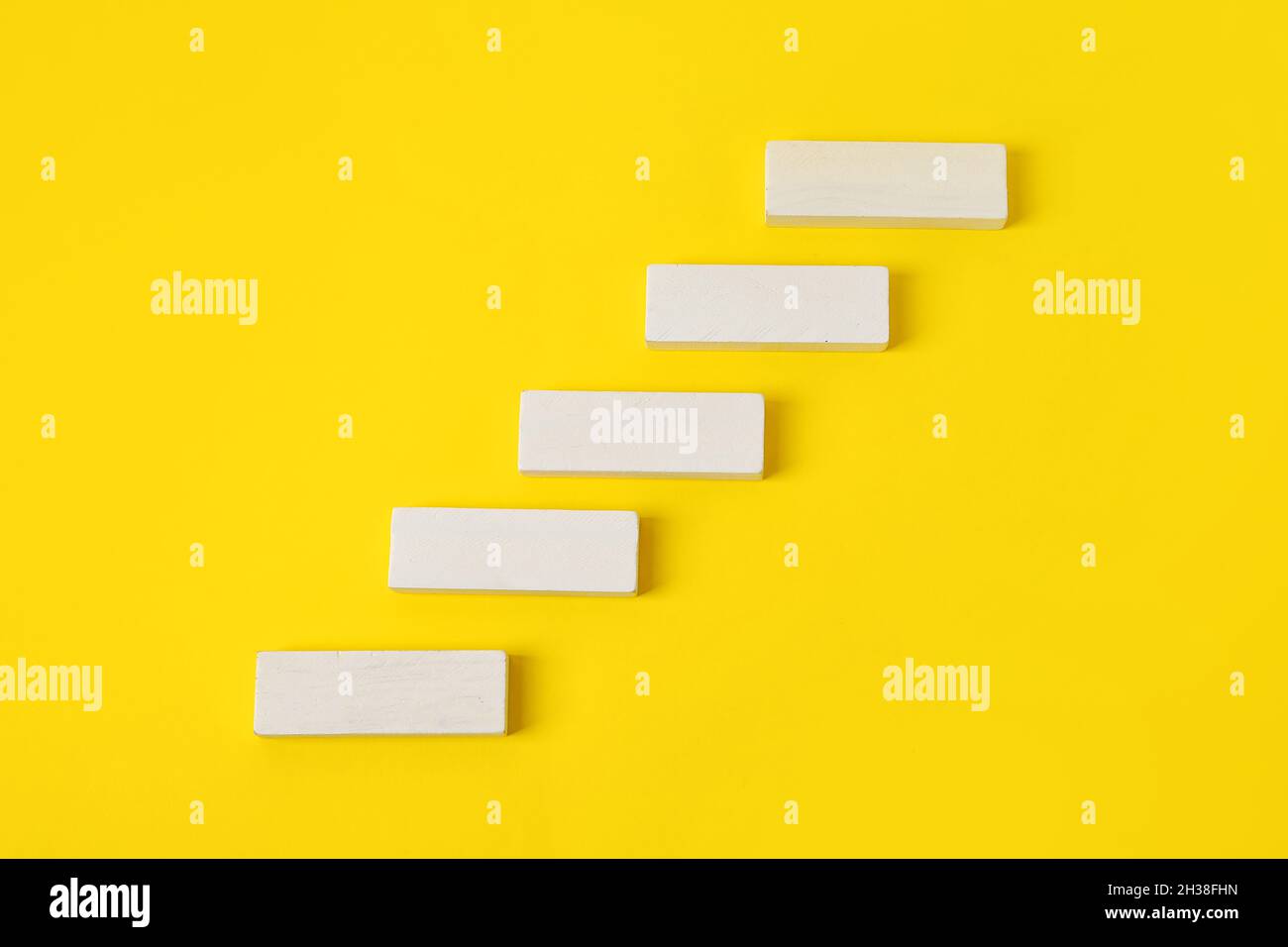 White blocks on yellow background Stock Photo