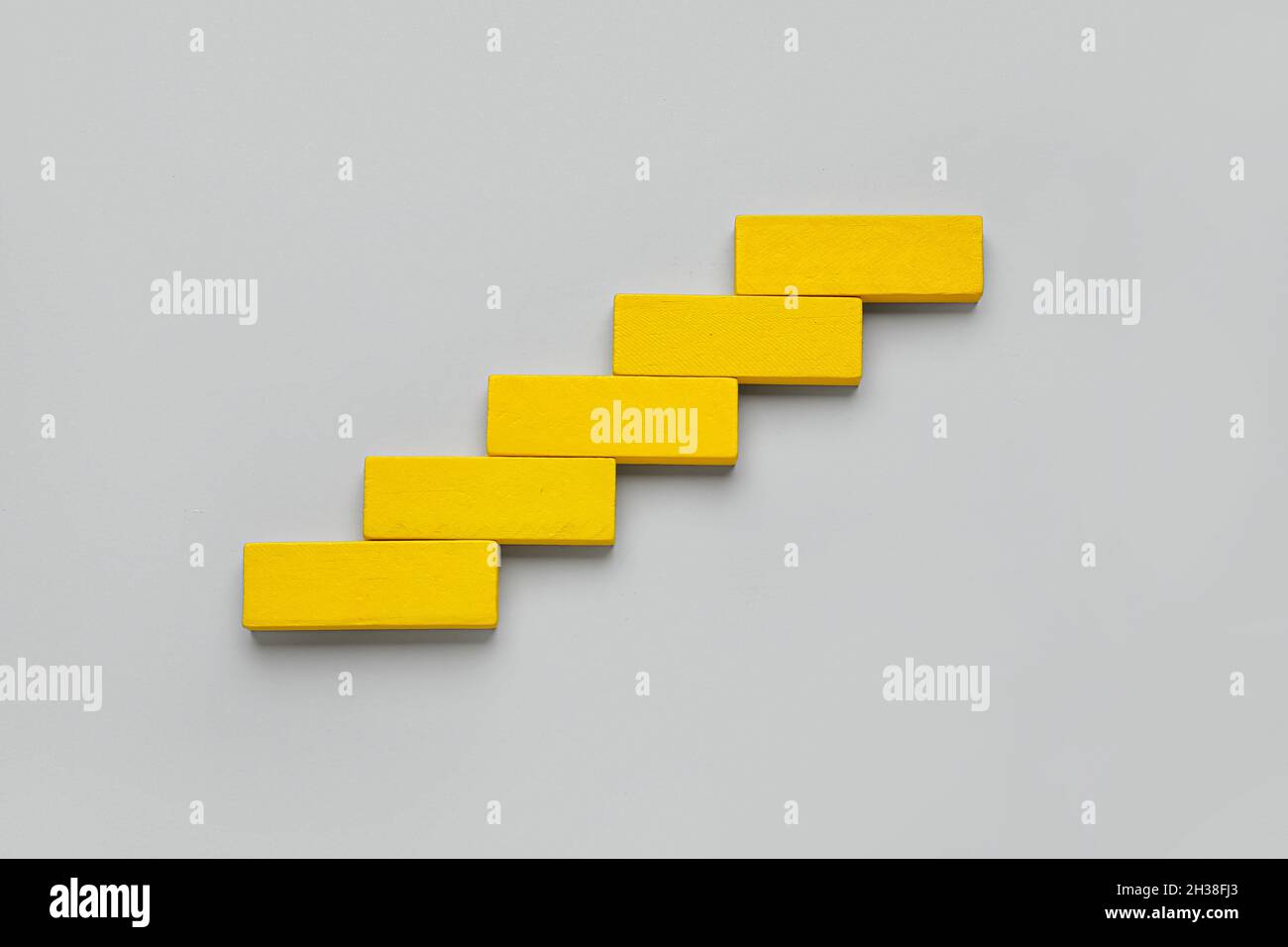 Yellow blocks on grey background Stock Photo