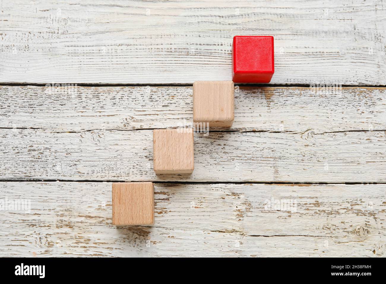 Cubes on white wooden background Stock Photo - Alamy